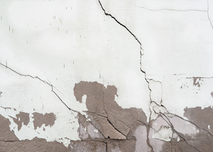 cracked wall texture showing damage and decay with peeling paint plus 14 cracks visible